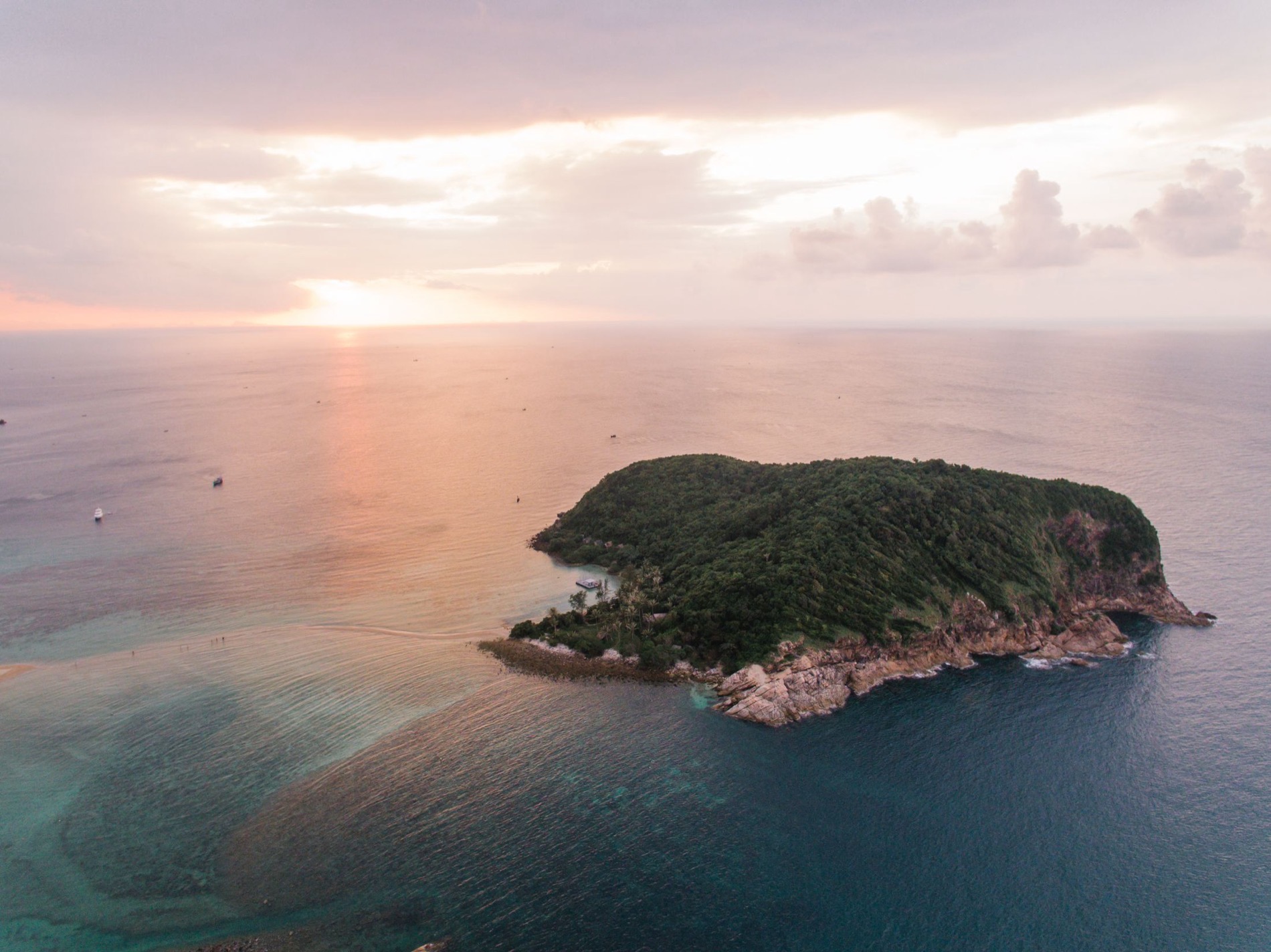 Aerial view of a tropical islet at sunset over the Gulf of Thailand